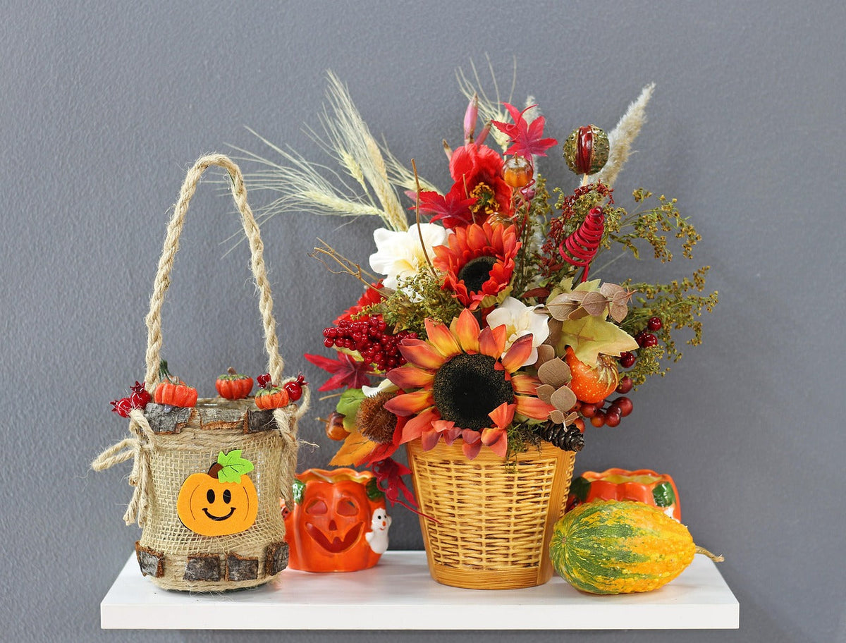 Autumn basket with a jack-o'-lantern and fall flowers, a boo basket idea